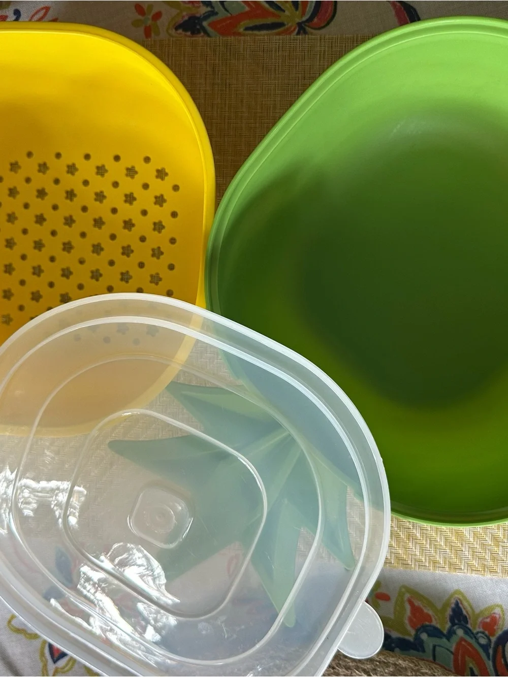 Croton Pineapple-Shaped Cutting Board in Yellow with Green Trim and Colander.